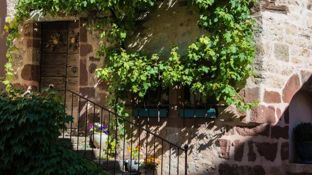 Limestone and red sandstone house in the center of La Canourgue Little Lozerian Venice.