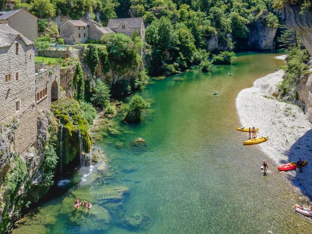 Gorges du Tarn, beach and waterfall at Saint Chély du Tarn. Canoeing and swimming