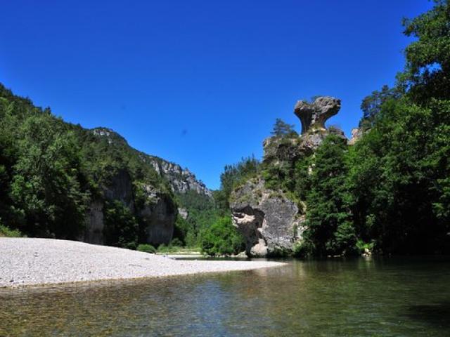 Rocher du champignon, at the water's edge in the Gorges du Tarn. Canoe descent.