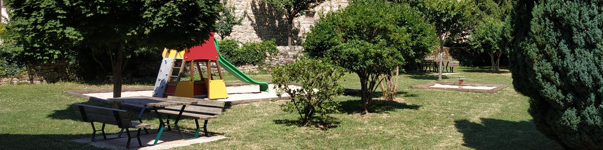 Playground and picnic area at La Canourgue in the new street beside the Urugne river