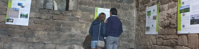Couple visit Chanac's medieval tower.