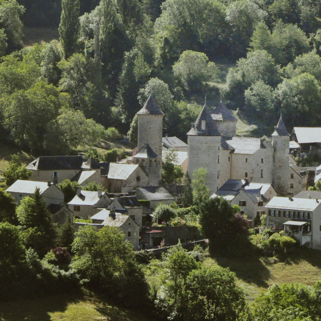Saint Saturnin de Tartaronne and its 13th-century château. It lies at the foot of the Causse de Sauveterre cliffs, 3 km from Banassac in the Lot Valley.