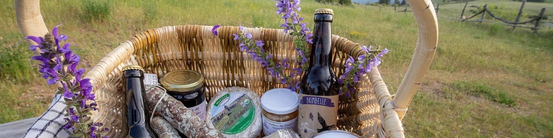 Basket of local products, cheese, charcuterie, jam and beer