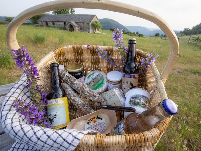 Basket of local products, cheese, charcuterie, jam and beer