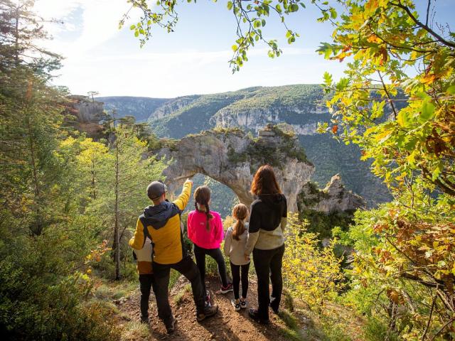 La Baousse del Biel, a limestone arch on the Causse Méjean corniche hiking trail overlooking the Gorges du Tarn.